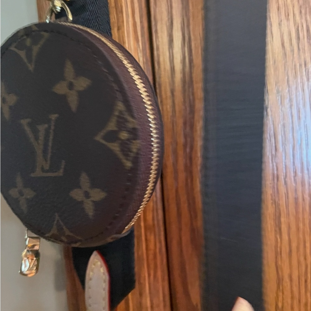Louis Vuitton Strap with change pouch.